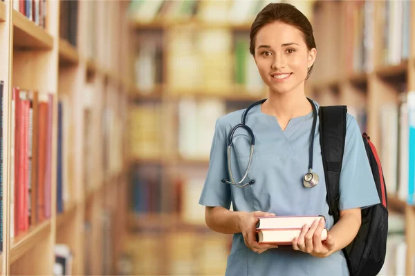 Enfermera estudiante con libros — Foto de Stock