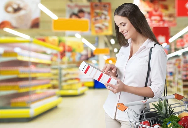 Woman with cart shopping — Stock Photo, Image