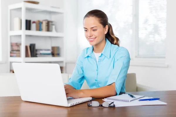 Attractive young woman using laptop