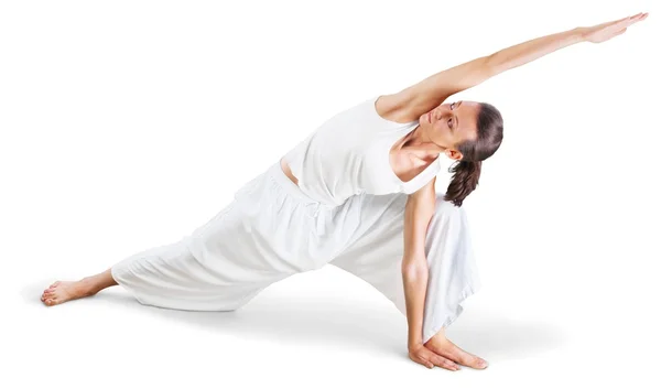 Mujer joven haciendo yoga —  Fotos de Stock