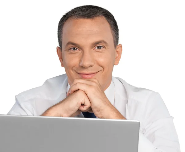 Portrait of happy businessman with laptop — Stock Photo, Image
