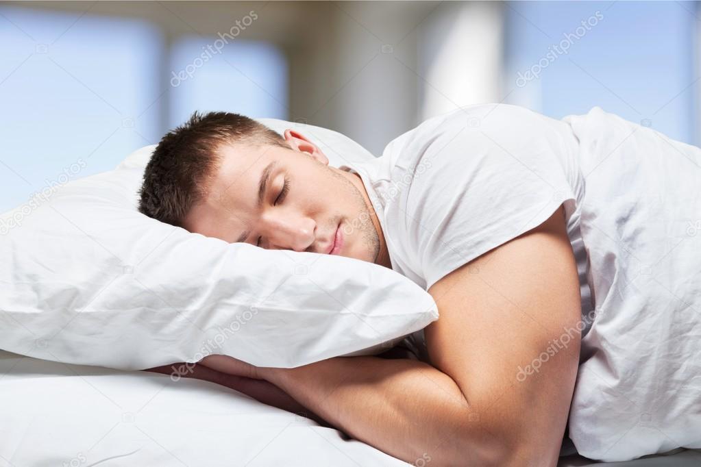 Sleeping man in bed