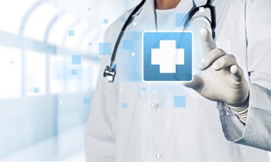 Tıbbi simge ve genç doktor 