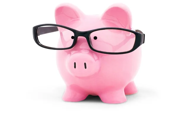 Piggy bank in glasses — Stock Photo, Image