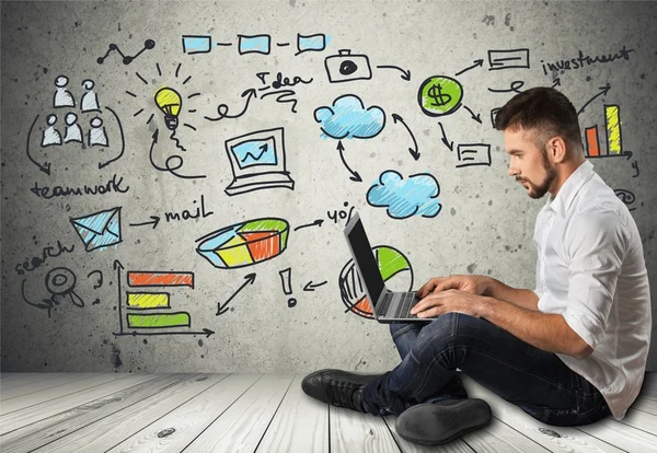 Portrait of happy businessman with laptop — Stock Photo, Image