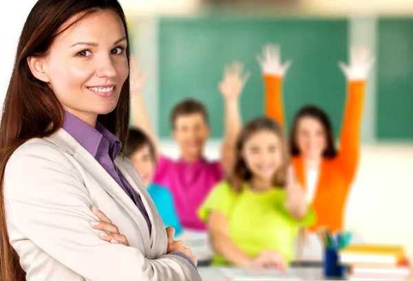 Female teacher with children at class