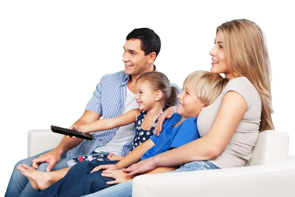 Rodina sleduje televizi doma — Stock fotografie