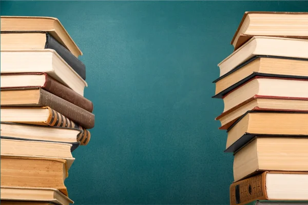 Stacks of books with green board — Stock Photo, Image