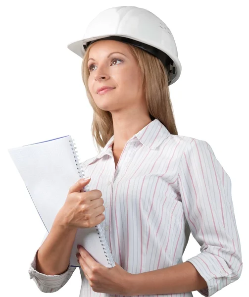 Female builder in helmet with notebook — Stock Photo, Image