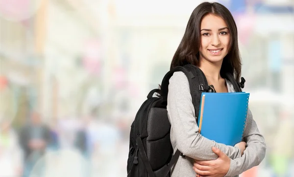 Student tjej anläggning bok — Stockfoto