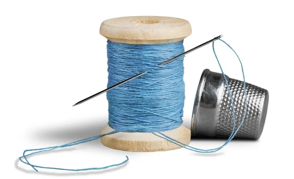 Spool with needle and thimble — Stock Photo, Image