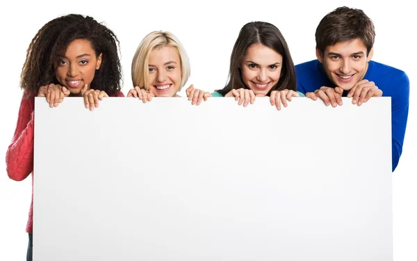 Adolescentes sosteniendo banner en blanco — Foto de Stock