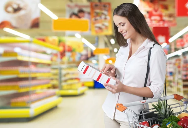 Woman with cart shopping — Stock Photo, Image