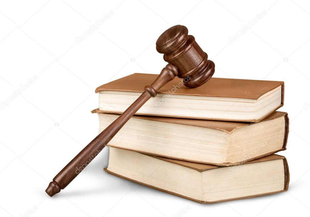 books and wooden gavel on table