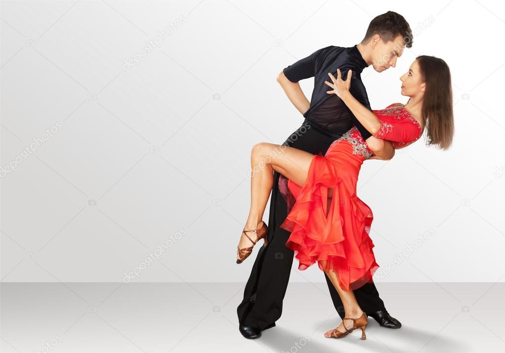 man and a woman dancing Salsa