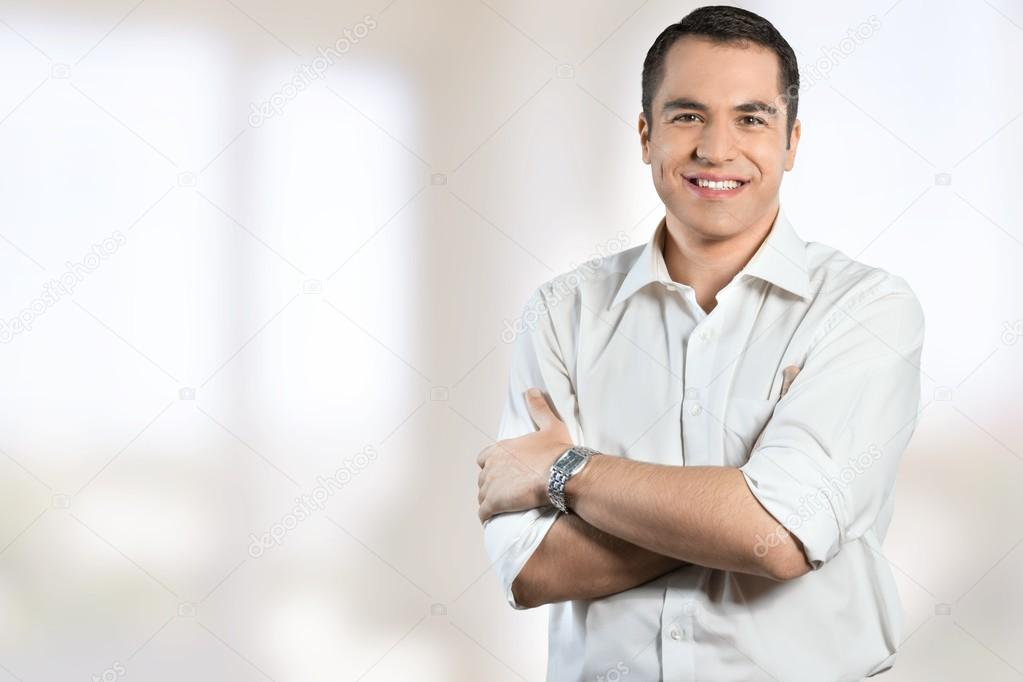 Confident businessman with crossed arms