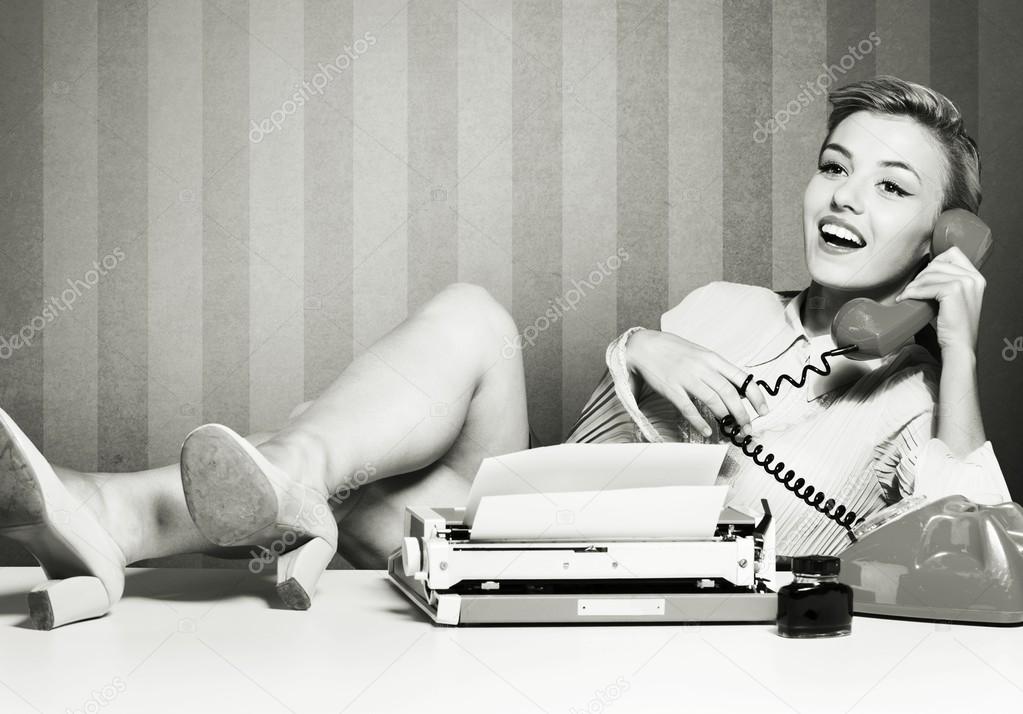 woman speaking on  vintage phone