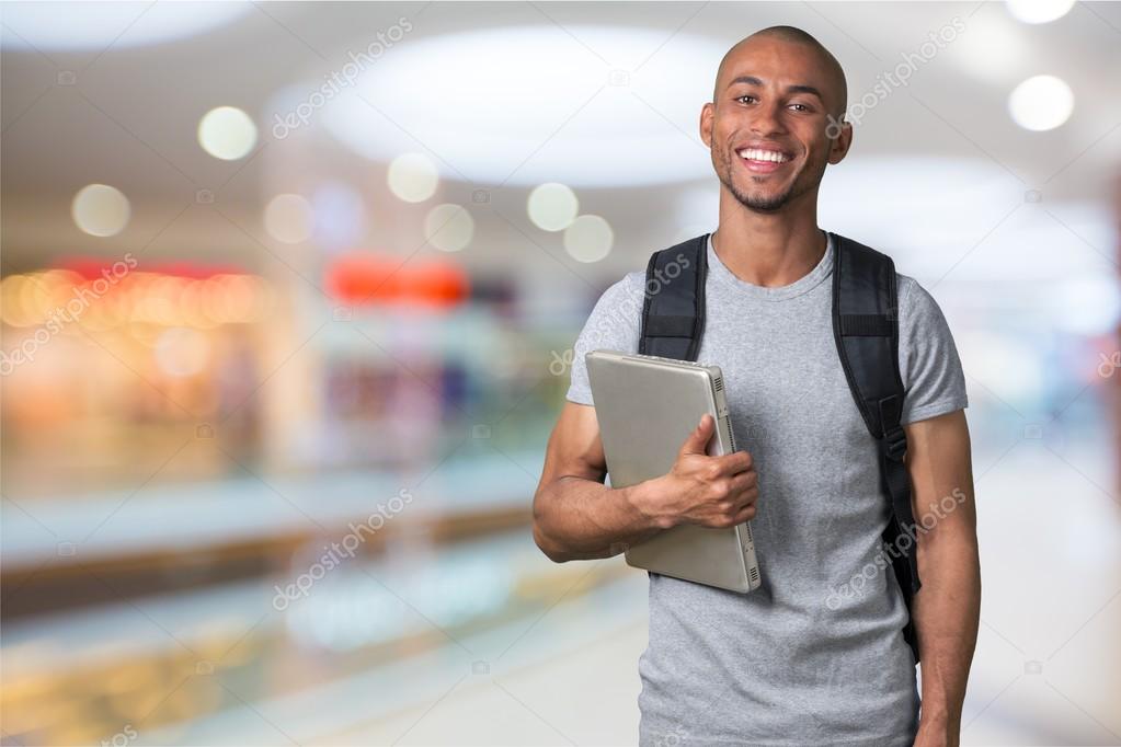 Male student with  backpack 