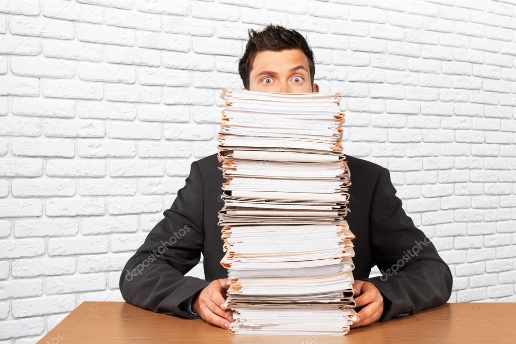 businessman with many business papers