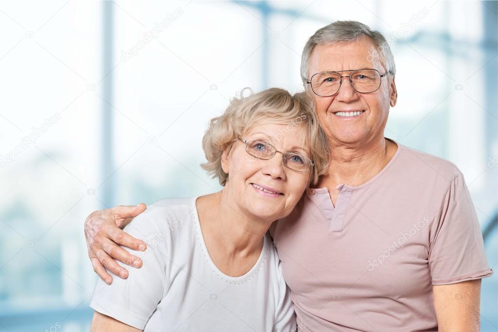 happy senior couple smiling at home