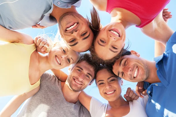 Happy young people in circle outdoors — Stock Photo, Image