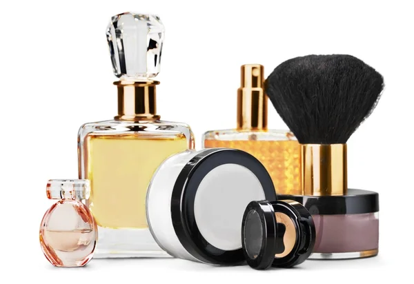 Perfume bottles and cosmetics with brush — Stock Photo, Image