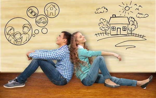 Couple sitting back-to-back — Stock Photo, Image