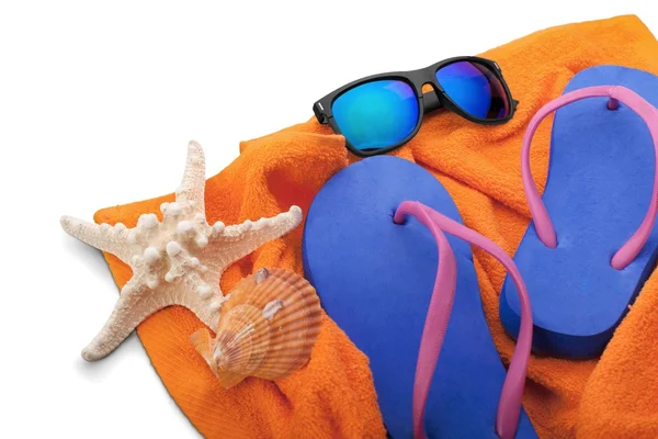 Flip-flops ,sunglasses and towel — Stock Photo, Image