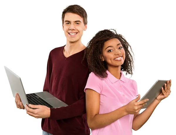 Schattige tieners met Tablet PC- en laptop — Stockfoto