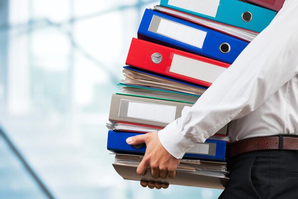  businessman with stack of papers