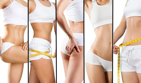 Young woman measuring her thin waist — Stock Photo, Image