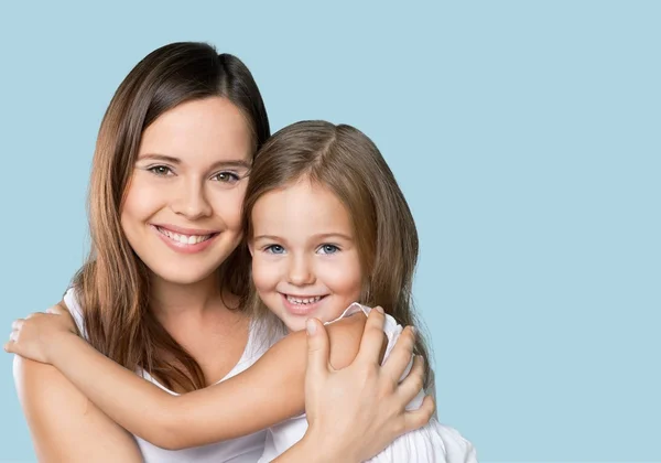 Mother and daughter hugging