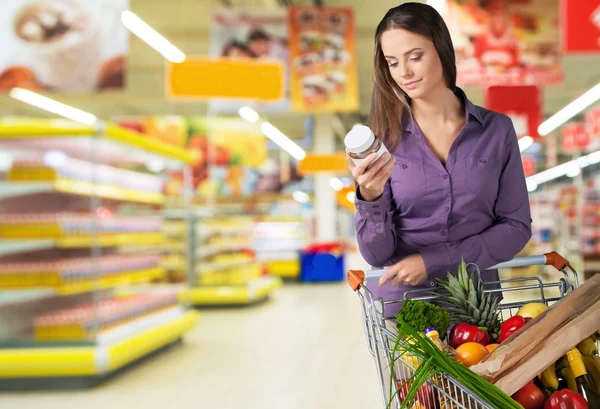 Woman with cart shopping — Stock Photo, Image