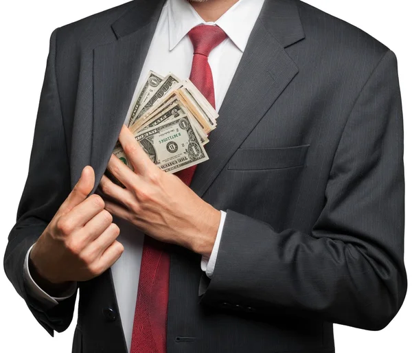 Бизнесмен кладет деньги в карман — стоковое фото