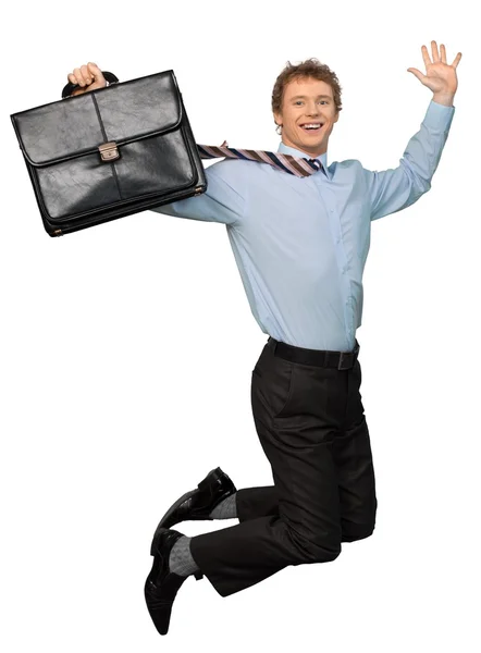 Feliz joven empresario saltando con hcase — Foto de Stock