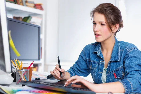 artist drawing something on graphic tablet