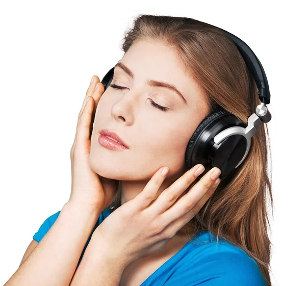 Jovem mulher em fones de ouvido — Fotografia de Stock