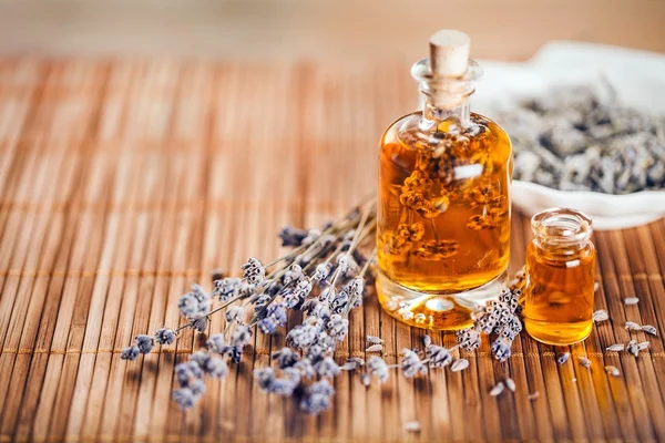 Lavender flowers and glass bottle