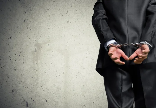 Man in handcuffs behind his back — Stock Photo, Image