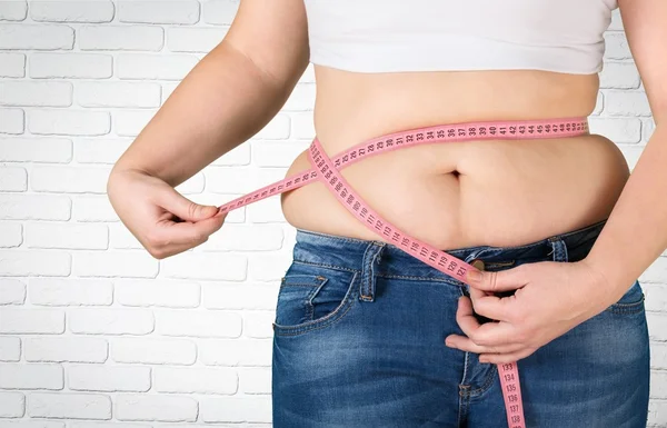 Figura femminile con metro a nastro — Foto Stock