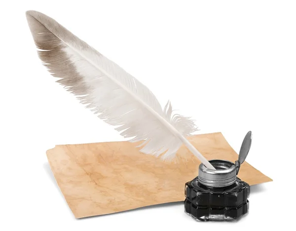 Feather quill pen and glass inkwell — Stock Photo, Image