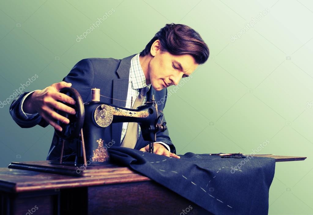 Confident young tailor sewing clothes stock photo billiondigital 118562146