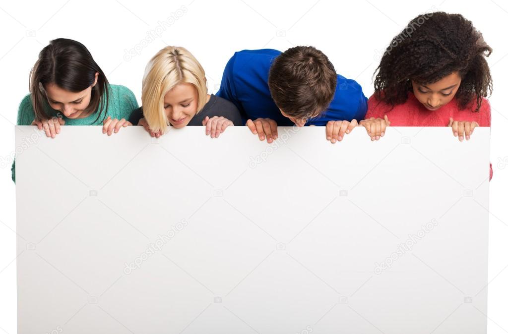 teens holding blank banner