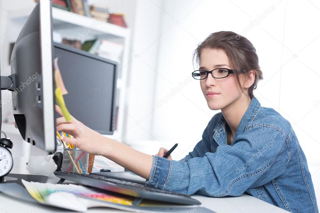 artist drawing something on graphic tablet 