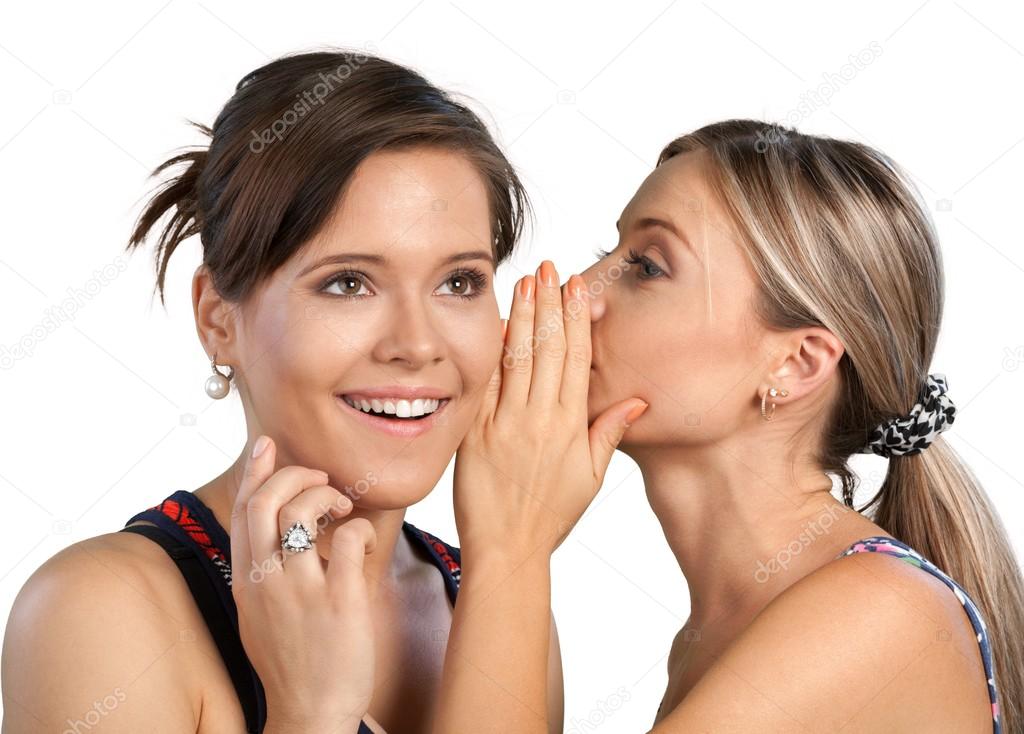 Woman revealing secret to her friend