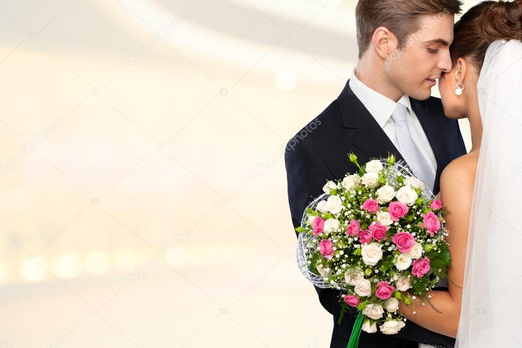 bride and groom hugging