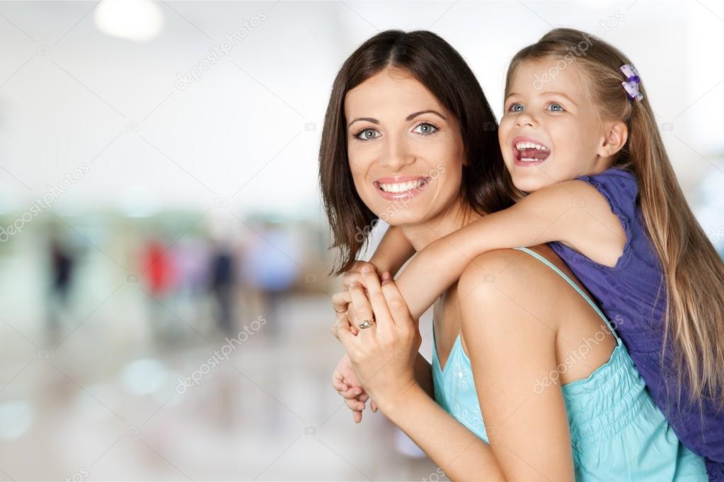 Mother and daughter hugging  