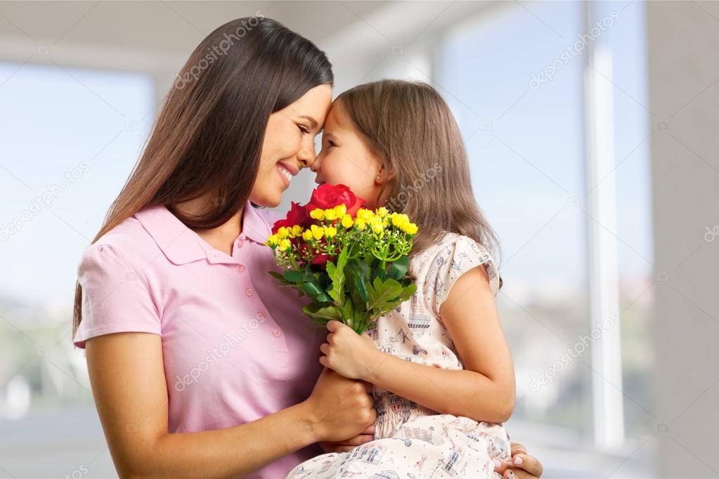 Mother and daughter hugging  