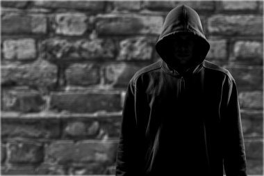 Dark unrecognisable man in hoodie clipart