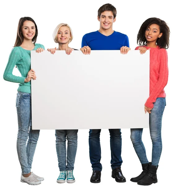 Adolescentes segurando banner em branco — Fotografia de Stock